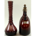 A 19th century amber glass decanter with a plated neck and stopper, together with a Venetian vase wi... 