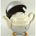 A 1930s WMF Bauscher bachelor's tea pot, Art Deco deign with the cream glazed ceramic body encircled... 