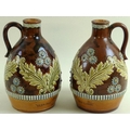 A pair of Royal Doulton majolica jugs, for Glen Dee Red Label John J Olivent Whisky Dealers of Bury ... 
