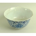 A Chinese porcelain tea bowl, Qing Dynasty, mid 18th century, decorated in underglaze blue with four... 