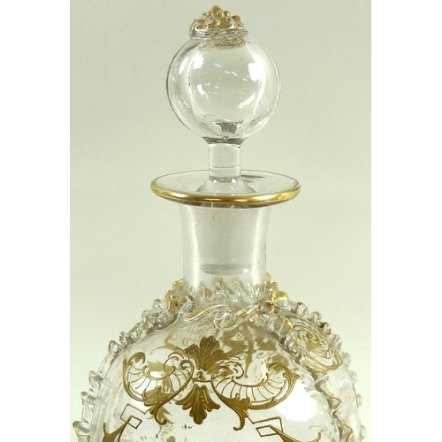 559 - A Venetian clear glass decanter and stopper, late 19th century, with gilt decoration, ground pontil,... 