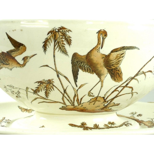 565 - A Copeland creamware part dinner service, Stork and Palm Tree pattern, October 1867, comprising two ... 