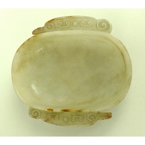 568 - A Chinese mutton fat jade dish, Qing Dynasty, 18th / 19th century, of rounded oblong form with two h... 