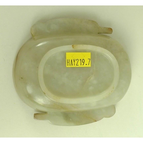 568 - A Chinese mutton fat jade dish, Qing Dynasty, 18th / 19th century, of rounded oblong form with two h... 