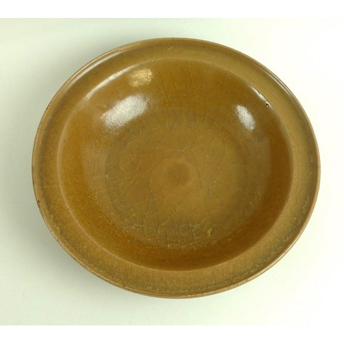 569 - A rare Chinese shallow dish, Sung / Song Dynasty (960-1279), of porcellanous stoneware with upturned... 