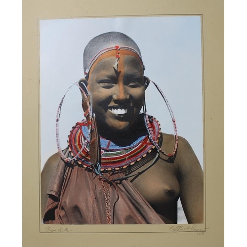 593 - A collection of three signed photographic prints of African ethnic tribal figures in traditional gar... 