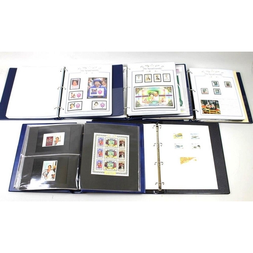 640 - A collection of stamps in five commemorative stamp albums, comprising The Ruby Wedding Anniversary C... 