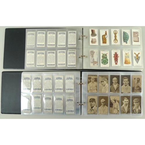 672 - A large and extensive collection of cigarette cards in two albums and loose, including Taddy 'Orders... 