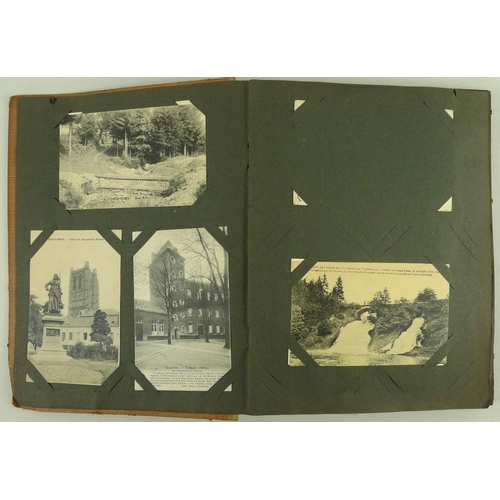 679 - Two early 20th century postcard and photograph albums, including various postcards dating from the E... 