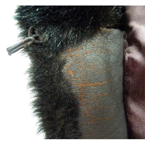 716 - Two fur coats, one a grey Angora example with belt, the other a black fur longcoat. (2)