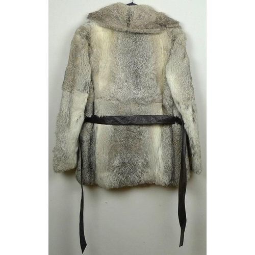 716 - Two fur coats, one a grey Angora example with belt, the other a black fur longcoat. (2)