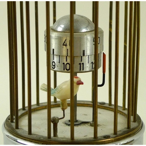 717 - A vintage Kaiser Bird Cage Alarm clock, complete with chromed stand and original instructions and gu... 