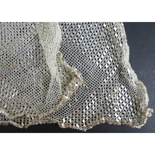 720 - Vintage Textiles: an Art Deco Assuit shawl the cream net ground decorated with hammered silver with ... 