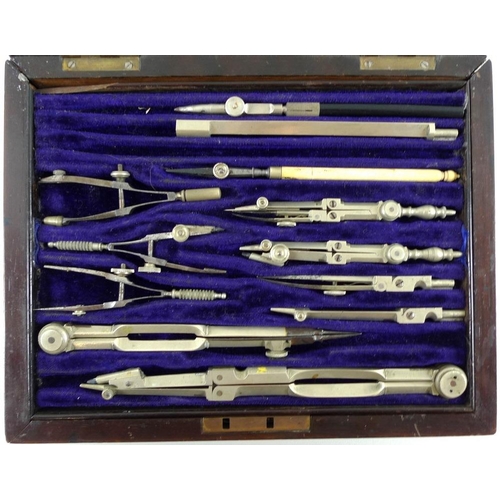 728 - An early 20th century mathematical drawing set, the rosewood veneered box containing multiple instru... 