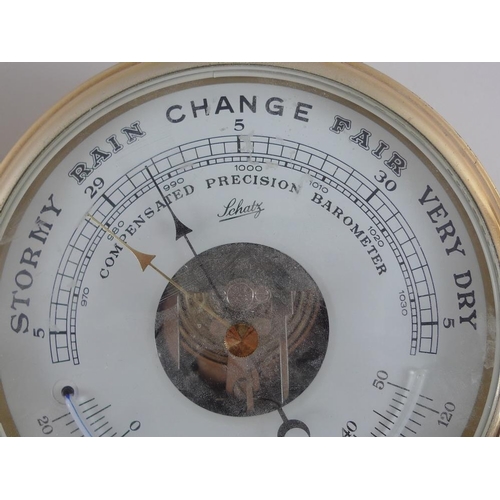 733 - A ship's porthole style dual barometer and thermometer, by Schatz, together with a similar port hole... 