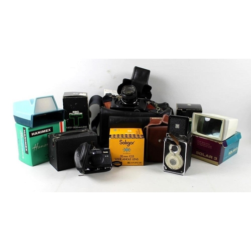 748 - A Rollei B35 camera, A Halina-Prefect Reflex camera, a Fujica st 705 together with  Fujinon 3.5 anf ... 