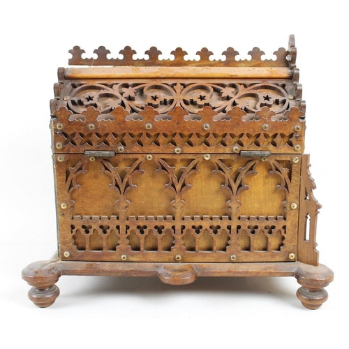 752 - A Victorian oak fretwork reliquary box, in Gothic taste, with lift lid enclosing purple velvet lined... 