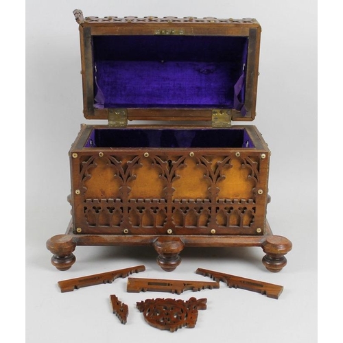 752 - A Victorian oak fretwork reliquary box, in Gothic taste, with lift lid enclosing purple velvet lined... 