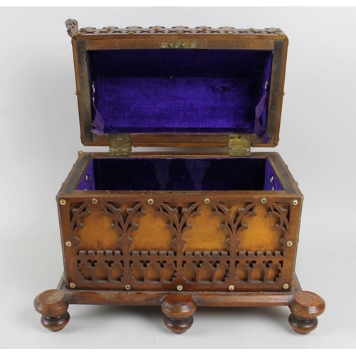 752 - A Victorian oak fretwork reliquary box, in Gothic taste, with lift lid enclosing purple velvet lined... 