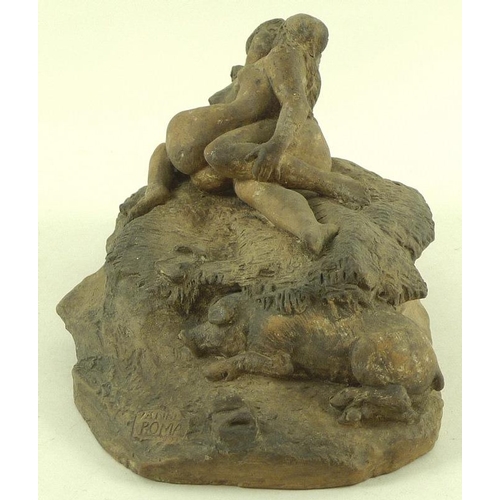 754 - A mid 20th century clay sculpture of two female lovers lying in a Sapphic pose on a roughly woven bl... 