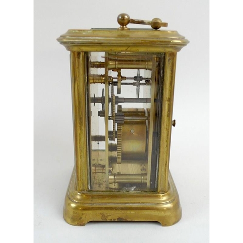 759 - A 19th century French brass carriage clock, with four bevelled glass panes, the white enamel face wi... 