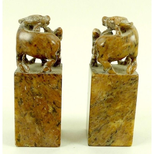 761 - A pair of Chinese hardstone carvings, early 20th century, modelled as a mirrored pair, depicting a w... 