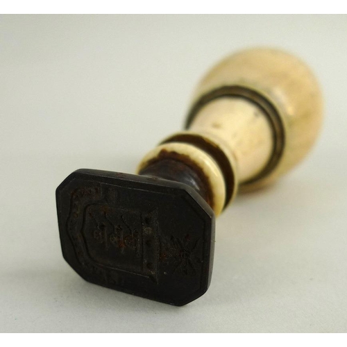 763 - A Victorian ivory handled desk seal, ring turned, the device with three canon, 8.5cm, together with ... 