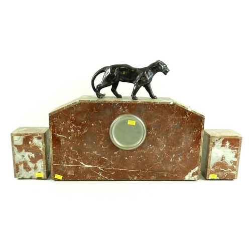 767 - A French Art Deco clock garniture, the clock with hollow cast patinated bronze lioness surmount abov... 