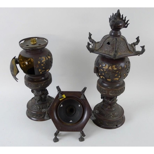 769 - A pair of early 20th century Chinese bronze freestanding lanterns, with removable hexagonal bell sha... 