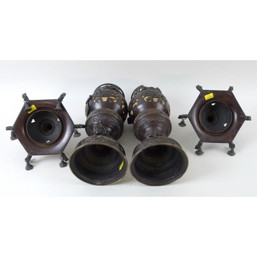 769 - A pair of early 20th century Chinese bronze freestanding lanterns, with removable hexagonal bell sha... 