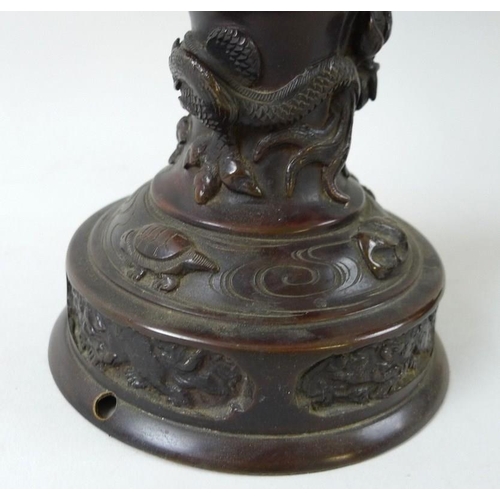 769 - A pair of early 20th century Chinese bronze freestanding lanterns, with removable hexagonal bell sha... 