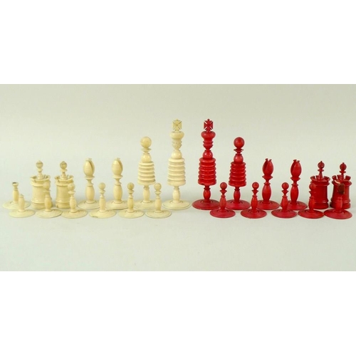 770 - A quantity of plain and red stained ivory chess pieces, early 20th century, from two different sets,... 