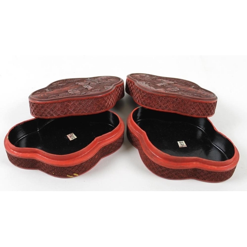 774 - A pair of Chinese cinnabar lacquer boxes, of quatrefoil forms, the lid of each carved with mirror im... 