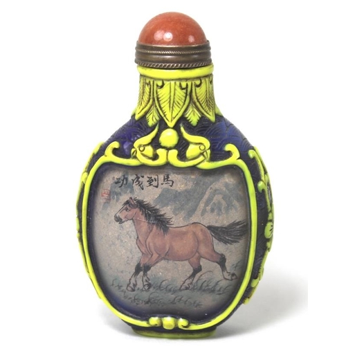 778 - A Chinese reverse painted glass snuff bottle the reserves decorated with a white horse and a brown h... 