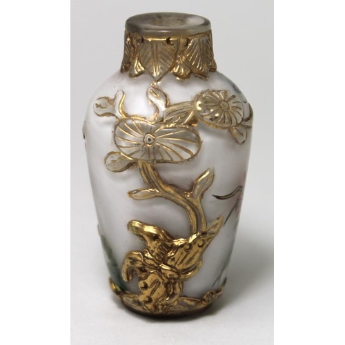 779 - A Chinese moulded snuff bottle, the gilded grasshopper in relief, with painted butterfly and dragonf... 