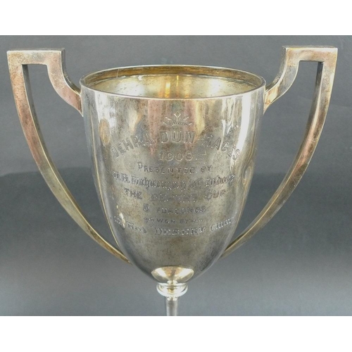 797 - Three Edwardian silver trophies, the first with two angular handles framing elongated body, beaded k... 