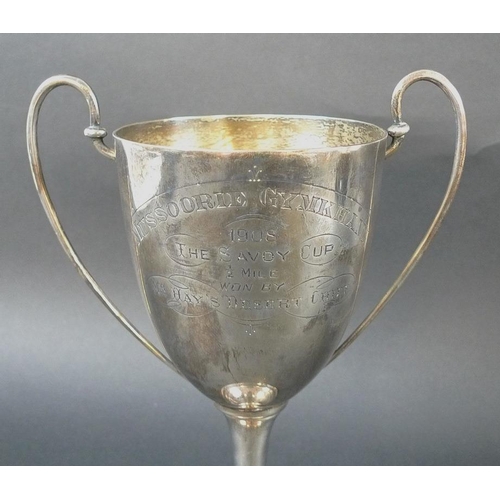 797 - Three Edwardian silver trophies, the first with two angular handles framing elongated body, beaded k... 