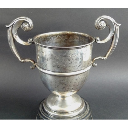 797 - Three Edwardian silver trophies, the first with two angular handles framing elongated body, beaded k... 