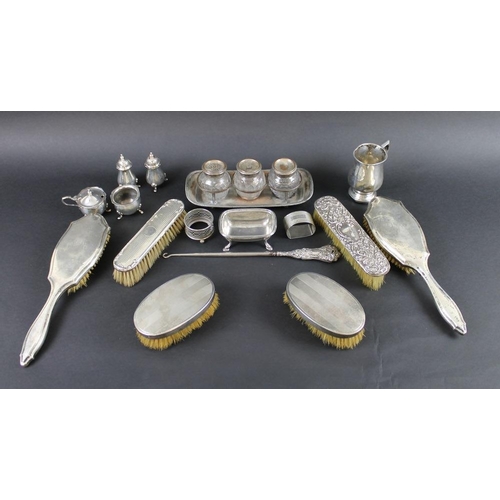 806 - A collection of silver and silver plate comprising a cruet set of pepper pots, salt and mustard pot,... 