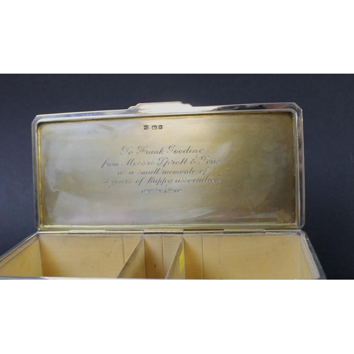 809 - A silver Art Deco cigarette box, Greek key design to edges of engine turned body, gilded interior of... 