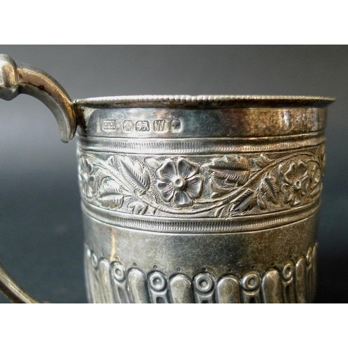 817 - A collection of silver, comprising a Victorian milk jug, the scalloped body chased and embossed with... 