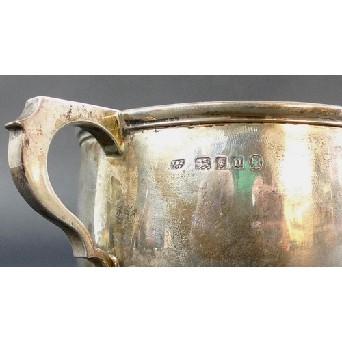 817 - A collection of silver, comprising a Victorian milk jug, the scalloped body chased and embossed with... 