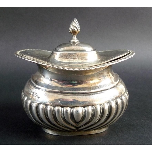 817 - A collection of silver, comprising a Victorian milk jug, the scalloped body chased and embossed with... 