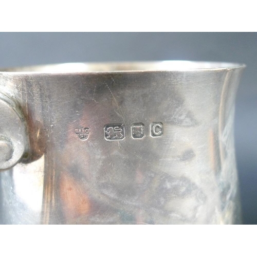 821 - A pair of George VI silver tankards, of rounded bellied form with ribbed feet, C-scrolls handles, Go... 