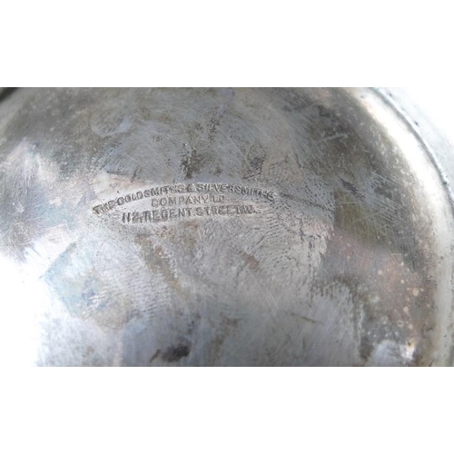 821 - A pair of George VI silver tankards, of rounded bellied form with ribbed feet, C-scrolls handles, Go... 