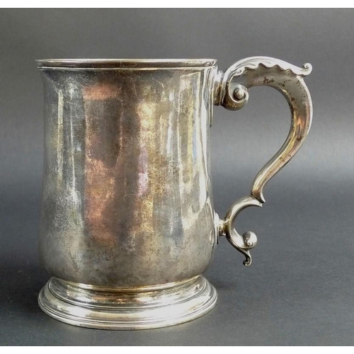 823 - An early George III silver tankard, of tapering plain cylindrical form, with scrolling acanthus hand... 