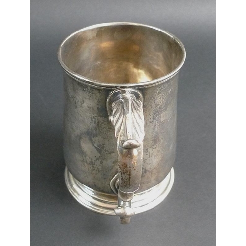 823 - An early George III silver tankard, of tapering plain cylindrical form, with scrolling acanthus hand... 