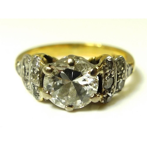 840 - A vintage 18ct gold and diamond ring, the central diamond of approximately 0.7ct, with six smaller d... 