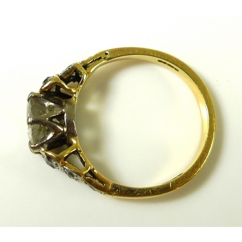 840 - A vintage 18ct gold and diamond ring, the central diamond of approximately 0.7ct, with six smaller d... 