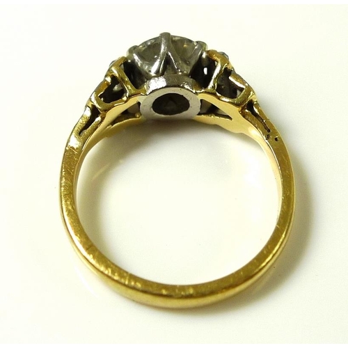 840 - A vintage 18ct gold and diamond ring, the central diamond of approximately 0.7ct, with six smaller d... 